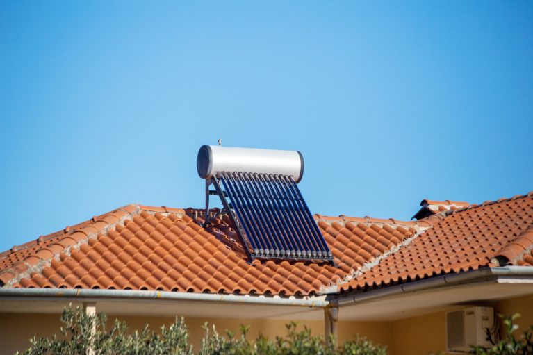 vaccum air collectors for water heating  on the roof alternative energy